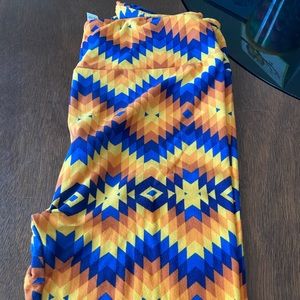 LLR Women’s - OS size leggings. Yellow, orange, navy blue Aztec print background